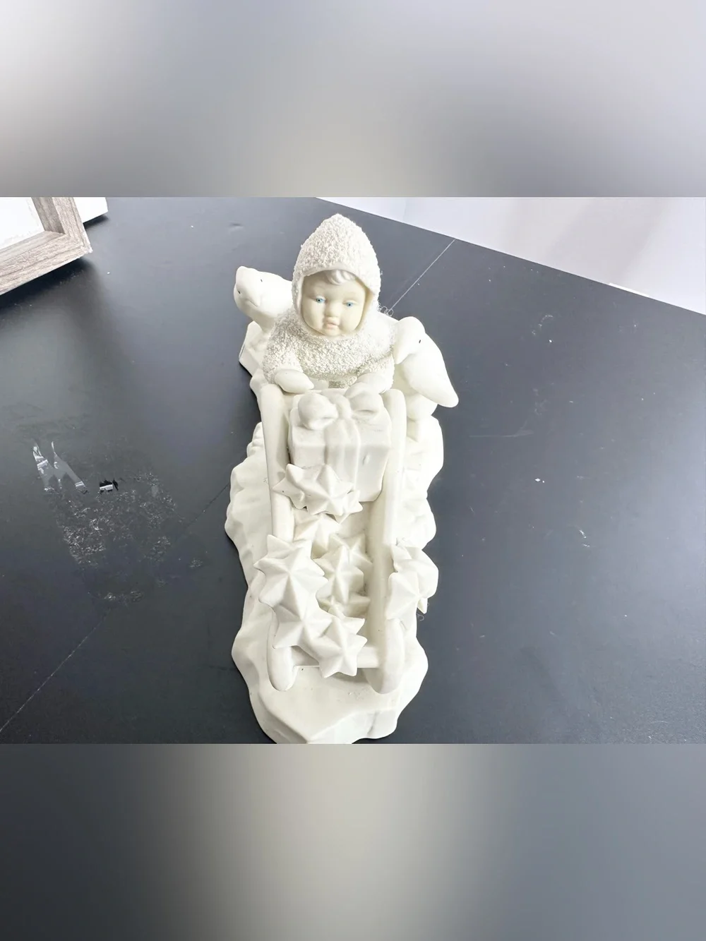 Department 56 Cream Ceramic Angel child on Sled Figurine